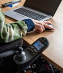 Disabled businessman working on his computer.