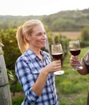 Wine grower family in vineyard before harvesting