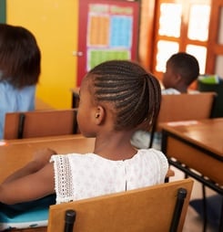 Back view of African kids in an elementary school class
