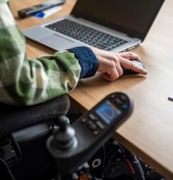 Disabled businessman working on his computer.